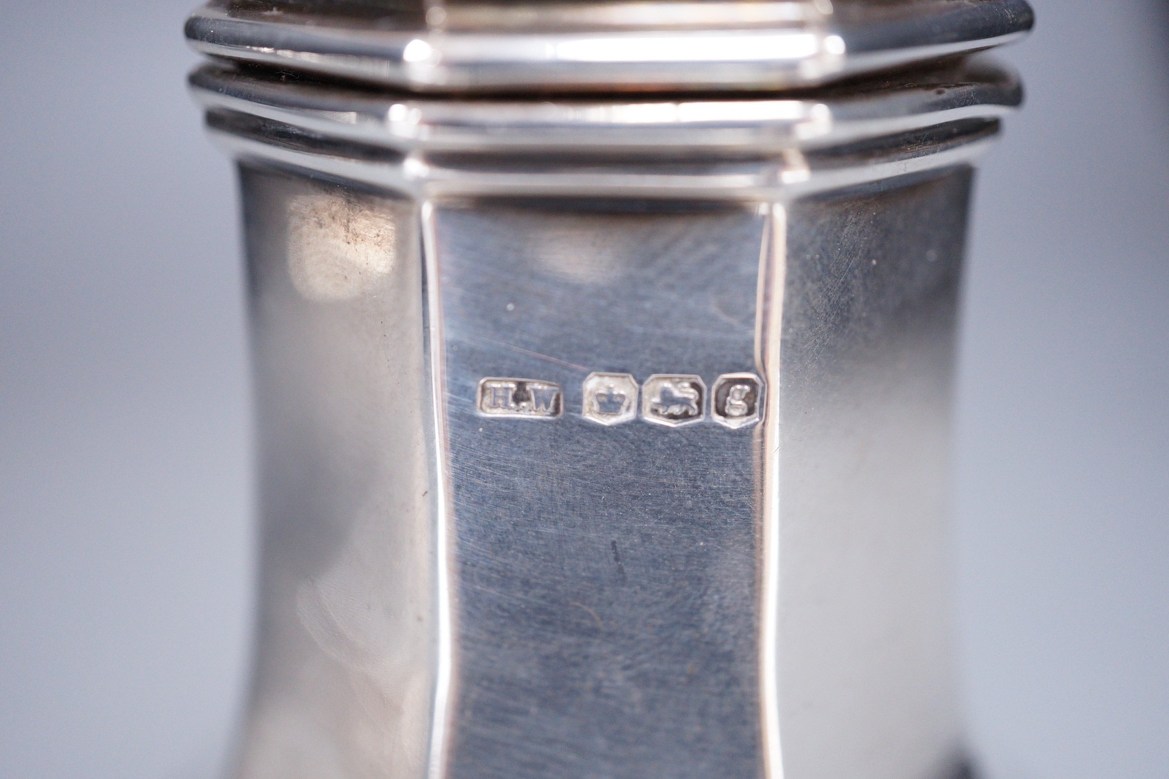 A George V silver octagonal sugar caster, Henry Wigfull, Sheffield, 1924, 18cm, 169 grams.